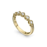Crafted in 14KT yellow gold, this ring features five rose-cut diamonds in cupcake settings on a vintage-inspired hand engraved band.