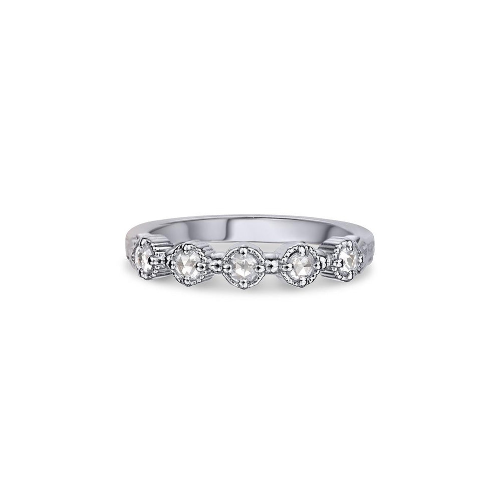 Crafted in 14KT white gold, this ring features five rose-cut diamonds in cupcake settings on a vintage-inspired hand engraved band.