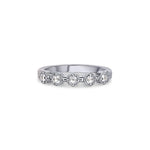 Crafted in 14KT white gold, this ring features five rose-cut diamonds in cupcake settings on a vintage-inspired hand engraved band.