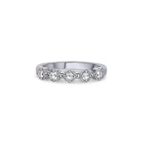 Crafted in 14KT white gold, this ring features five rose-cut diamonds in cupcake settings on a vintage-inspired hand engraved band.