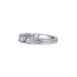 Crafted in 14KT white gold, this ring features five rose-cut diamonds in cupcake settings on a vintage-inspired hand engraved band.