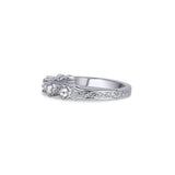 Crafted in 14KT white gold, this ring features five rose-cut diamonds in cupcake settings on a vintage-inspired hand engraved band.