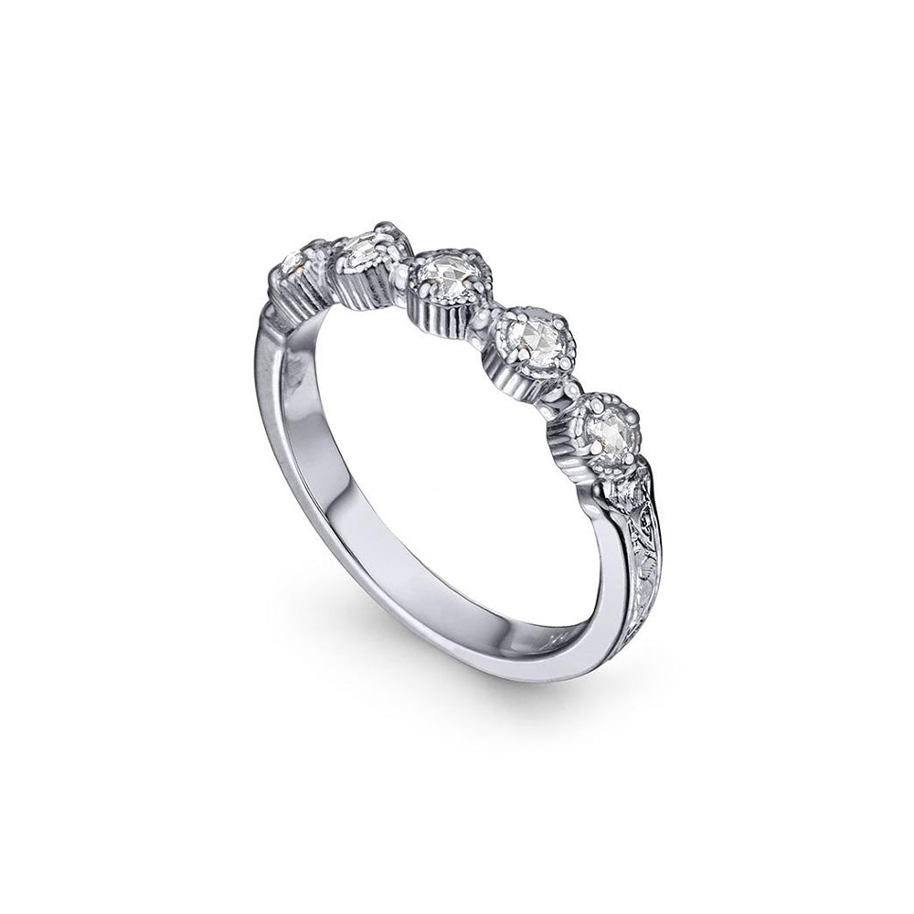 Crafted in 14KT white gold, this ring features five rose-cut diamonds in cupcake settings on a vintage-inspired hand engraved band.