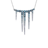 Crafted in 14KT white Certified Canadian Gold, this necklace features blue topaz and round brilliant-cut Canadian diamonds set in the shape of icicles.