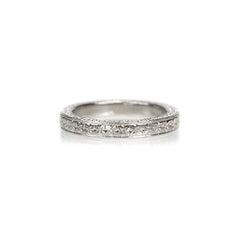 Crafted in 14KT white gold, this band is hand-engraved with an orange blossom design.