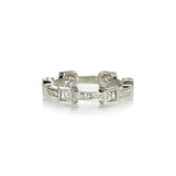 Crafted in 14KT white gold, this ring features six princess-cut diamonds in square bezels and flat edges with orange blossom hand-engravings.
