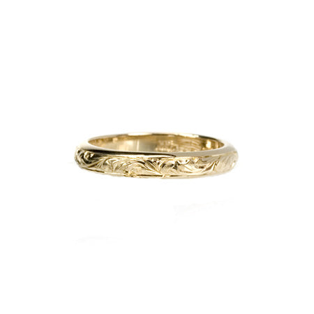 Crafted in 14KT yellow gold, this band has paisley hand-engraving.
