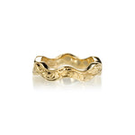 Crafted in 14KT yellow gold, this ring has a ruffled band with orange blossom hand-engravings.