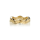 Crafted in 14KT yellow gold, this ring has a ruffled band with orange blossom hand-engravings.