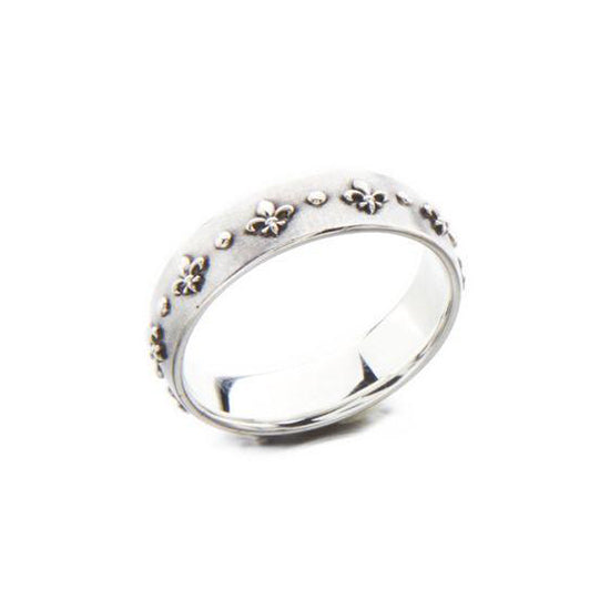 Crafted in 14KT white gold, this ring is embossed with Fleur de Lys all around the band.