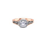 Crafted in 18KT white and rose Certified Canadian Gold, this engagement ring features a diamond halo with a round brilliant-cut Canadian centre diamond on a diamond set band with a rose vine design.