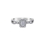 Crafted in 18kt Pure White™, this engagement ring features a diamond set emerald-shaped halo with an emerald-cut Canadian centre diamond. All on a diamond set infinity symbol-inspired band.