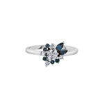 Crafted in 14KT Canadian Certified Gold, this diamond ring features a wildflower-inspired shape set with round brilliant cut Canadian diamonds and blue sapphires.