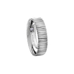 Crafted in 14KT white Certified Canadian Gold, this men’s ring features a stream water-inspired pattern set with a round brilliant-cut Canadian diamond hidden on the inside of the band.