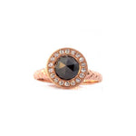 Crafted in 14KT rose gold, this ring features a diamond halo with a black rose-cut diamond centre and a quilted band. 