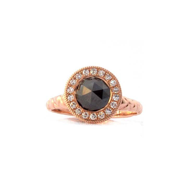 Crafted in 14KT rose gold, this ring features a diamond halo with a black rose-cut diamond centre and a quilted band. 