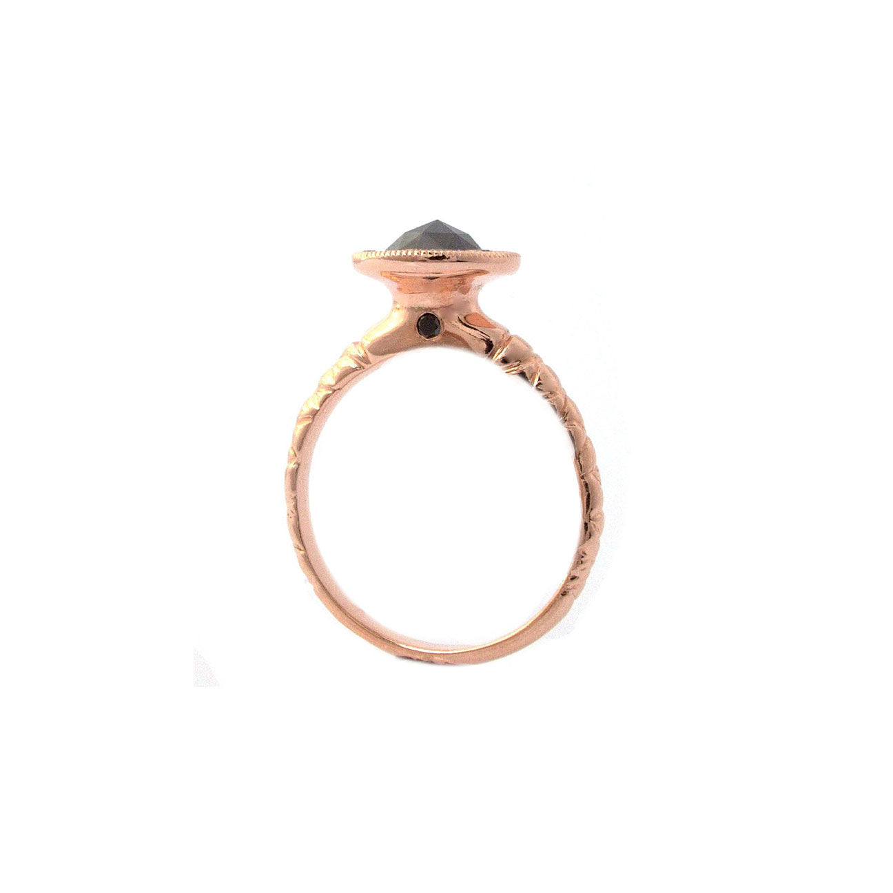 Crafted in 14KT rose gold, this ring features a diamond halo with a black rose-cut diamond centre and a quilted band. 