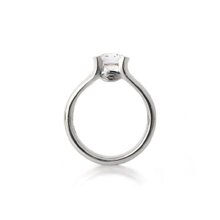 Crafted in 14KT white gold, this ring features a half-bezel set round brilliant-cut diamond with signature trademark on both sides.