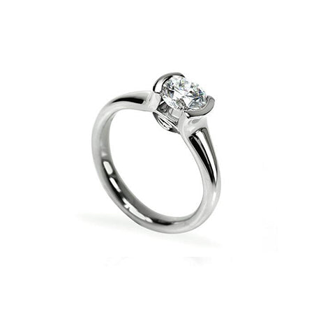 Crafted in 14KT white gold, this ring features a half-bezel set round brilliant-cut diamond with signature trademark on both sides.