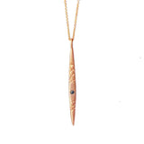 Crafted in 14KT rose gold, this spear-inspired pendant features a round black diamond and quilted details.