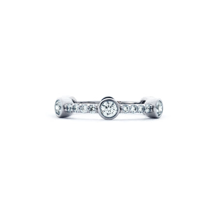 Crafted in 14KT white gold, this ring features six round brilliant-cut diamonds evenly spaced apart on a diamond set band.
