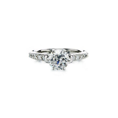 Crafted in 14KT white gold, this ring features a round brilliant-cut centre diamond on a diamond-set band.