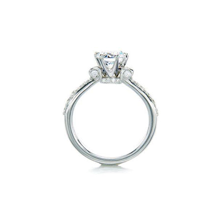 Crafted in 14KT white gold, this ring features a round brilliant-cut centre diamond on a diamond-set band.