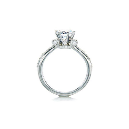 Crafted in 14KT white gold, this ring features a round brilliant-cut centre diamond on a diamond-set band. 