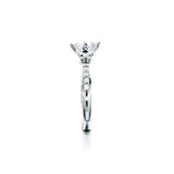 Crafted in 14KT white gold, this ring features a princess-cut centre diamond on a diamond-set band.