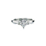 Crafted in 14KT white gold, this ring features a princess-cut centre diamond and round brilliant-cut diamond details. 