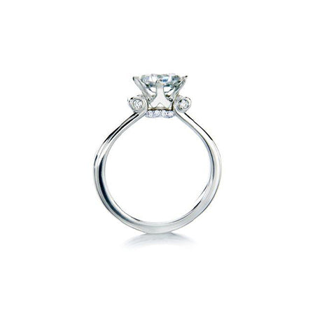 Crafted in 14KT white gold, this ring features a princess-cut centre diamond and round brilliant-cut diamond details.