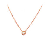 Crafted in 14KT gold, this necklace is set with a white rose-cut diamond.