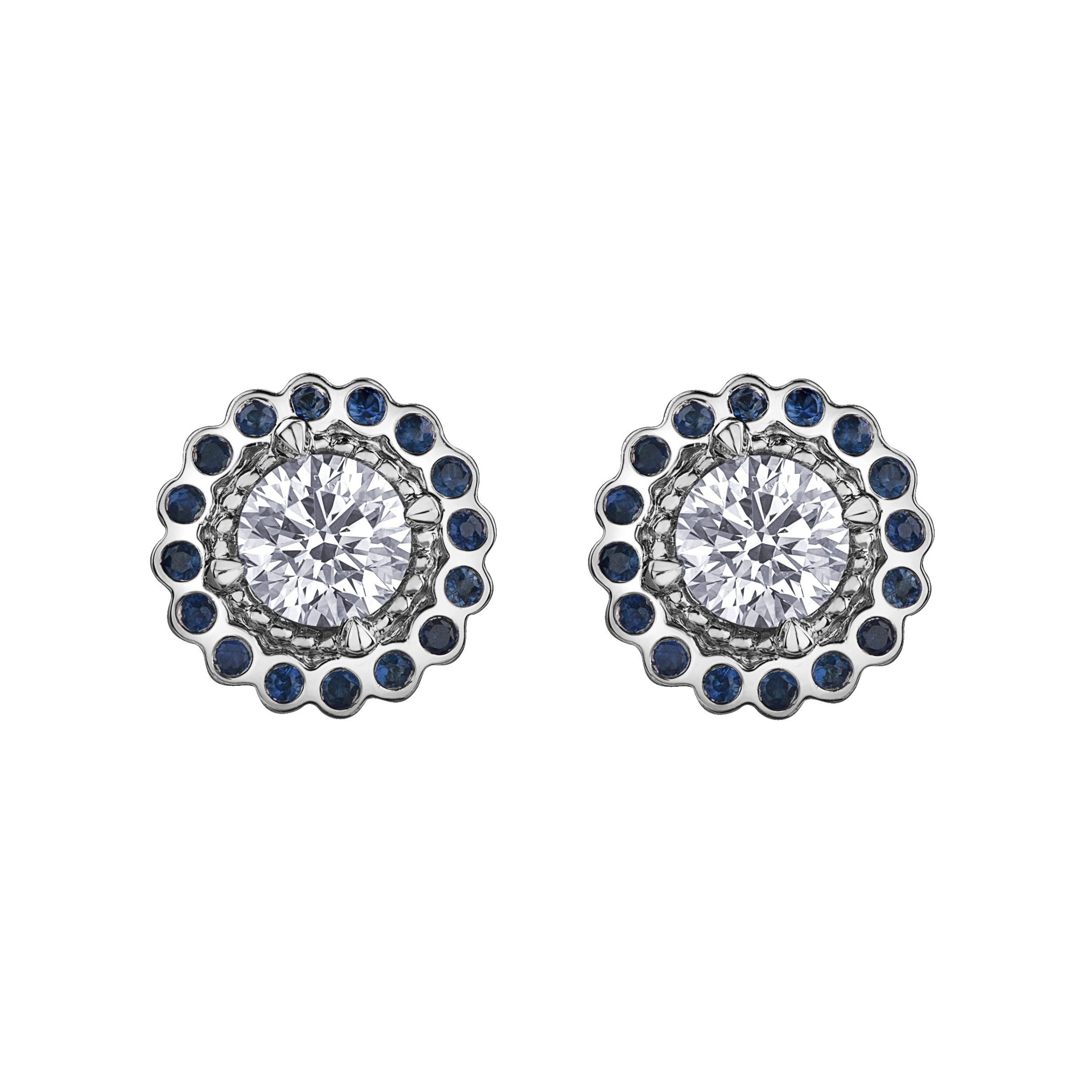 Crafted in 18KT white Canadian Certified Gold, these stud earrings feature regal blue sapphire halos with round brilliant-cut Canadian centre diamonds.