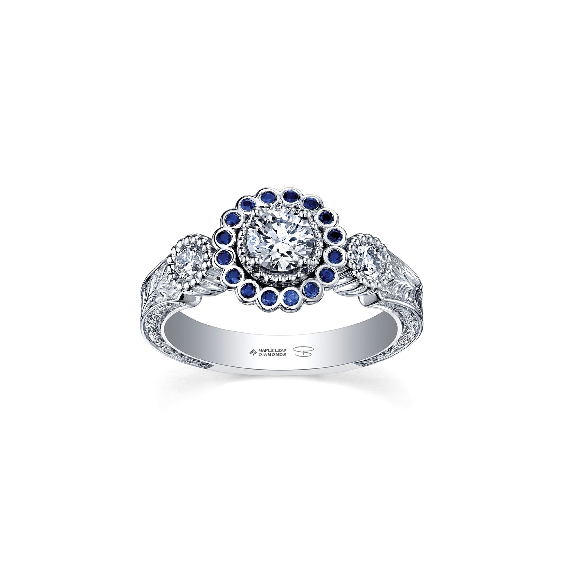Crafted in 18KT white Canadian Certified Gold, this ring features a regal blue sapphire halo with a round brilliant-cut Canadian centre diamond on a frost-inspired hand engraved band.