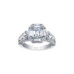 Crafted in 18kt Pure White™, this ring features an emerald-cut Canadian centre diamond framed by round and baguette-cut diamonds on a frost-inspired hand engraved band with a blue sapphire detail.