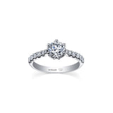 Crafted in 18kt Pure White™, this engagement ring features a round brilliant-cut Canadian diamond cradled by 6-petal water lily flower on a diamond set band.
