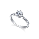 Crafted in 18kt Pure White™, this engagement ring features a round brilliant-cut Canadian diamond cradled by 6-petal water lily flower on a diamond set band.