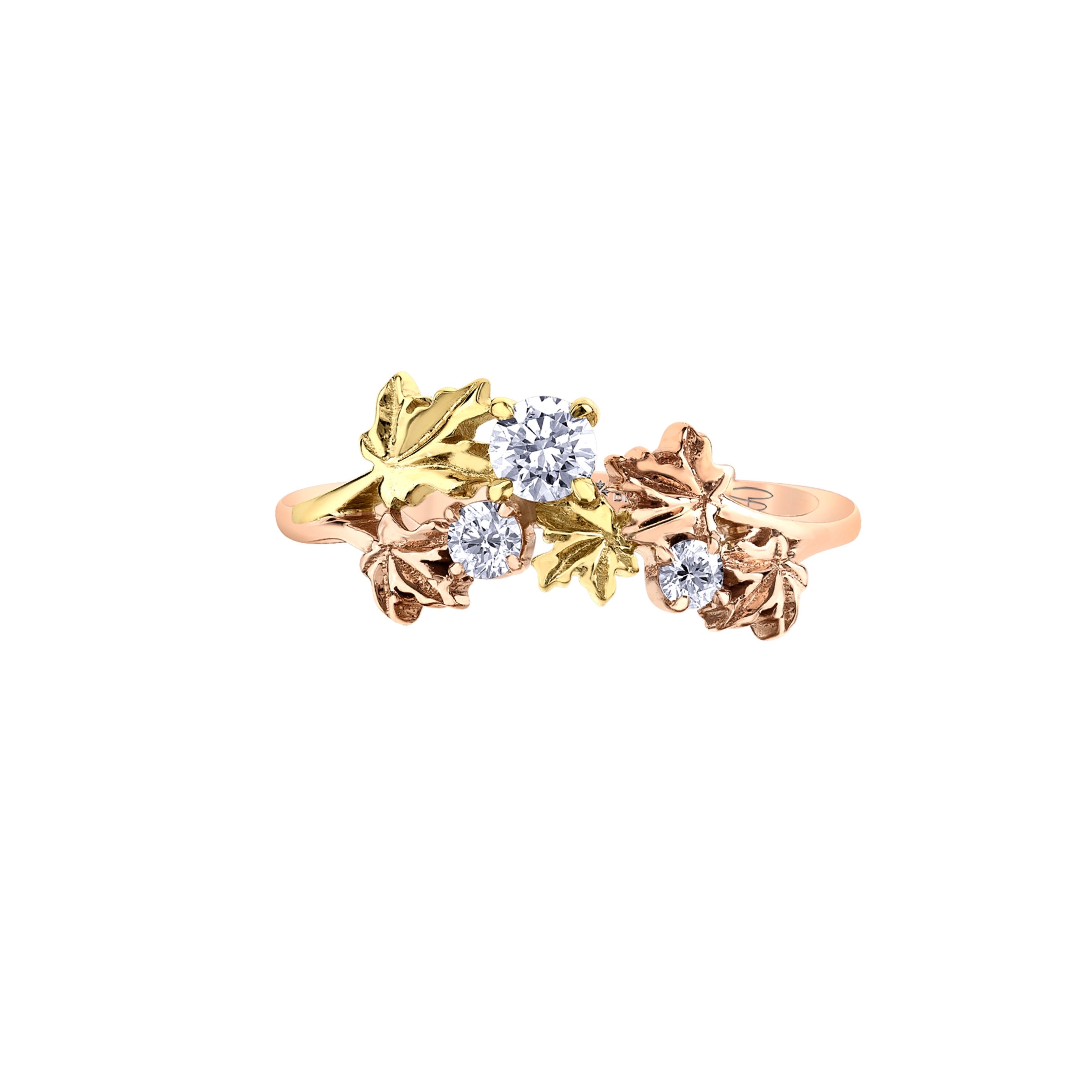 Crafted in 14KT rose and yellow Certified Canadian Gold, this ring features five maple leaves cradling three round brilliant-cut Canadian diamonds.