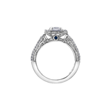 18k white and yellow gold ring with emerald-cut Canadian diamond, frost engravings, diamond halo, and blue sapphire.