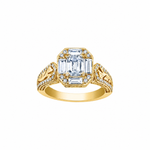 18k white and yellow gold ring with emerald-cut Canadian diamond, frost engravings, diamond halo, and blue sapphire.
