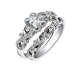 18kt gold engagement ring with oval-cut Canadian diamond, diamond side stones, and intricate rose vine detailing, 0.45 TDW.