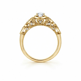 18kt gold engagement ring with oval-cut Canadian diamond, diamond side stones, and intricate rose vine detailing, 0.45 TDW.