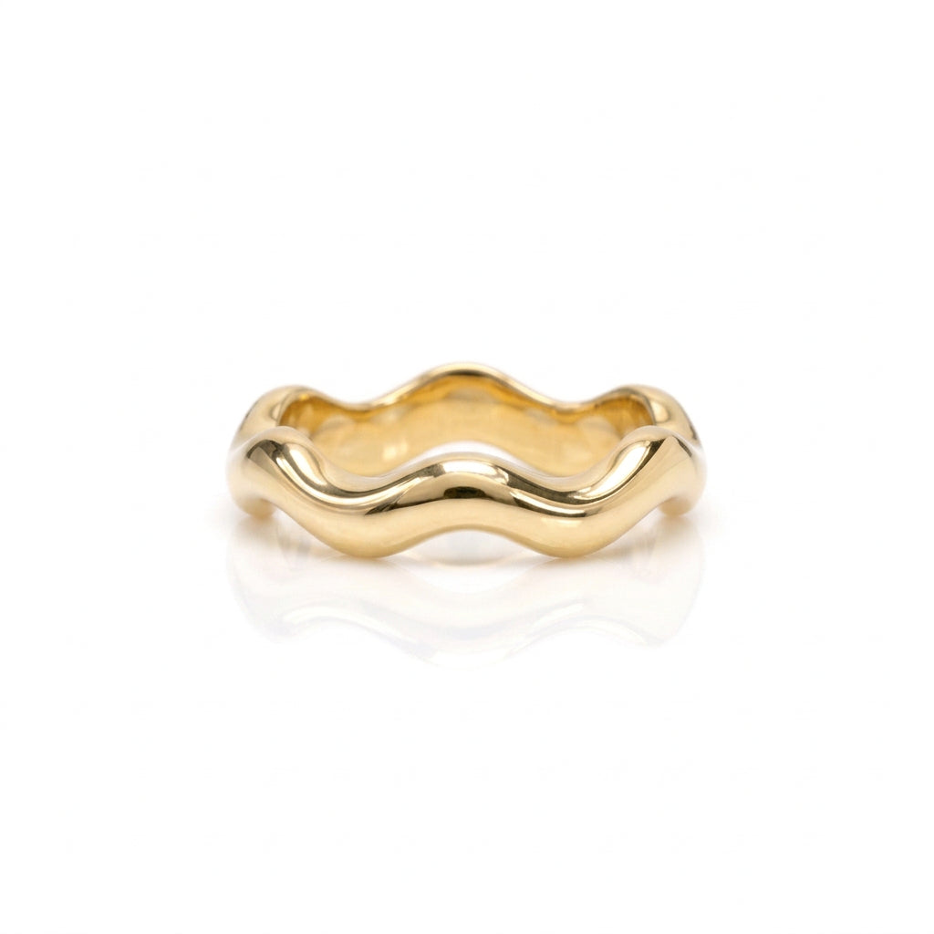 Ruffle pattern band crafted in 14KT gold. 