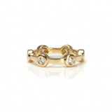Crafted in 14KT gold, this ring features six round brilliant-cut diamonds evenly spaced apart in bezel settings on a flat band.
