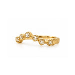 A gold ring featuring five small round Rosecut diamond gemstones set along a textured band, photographed on a clean white background.