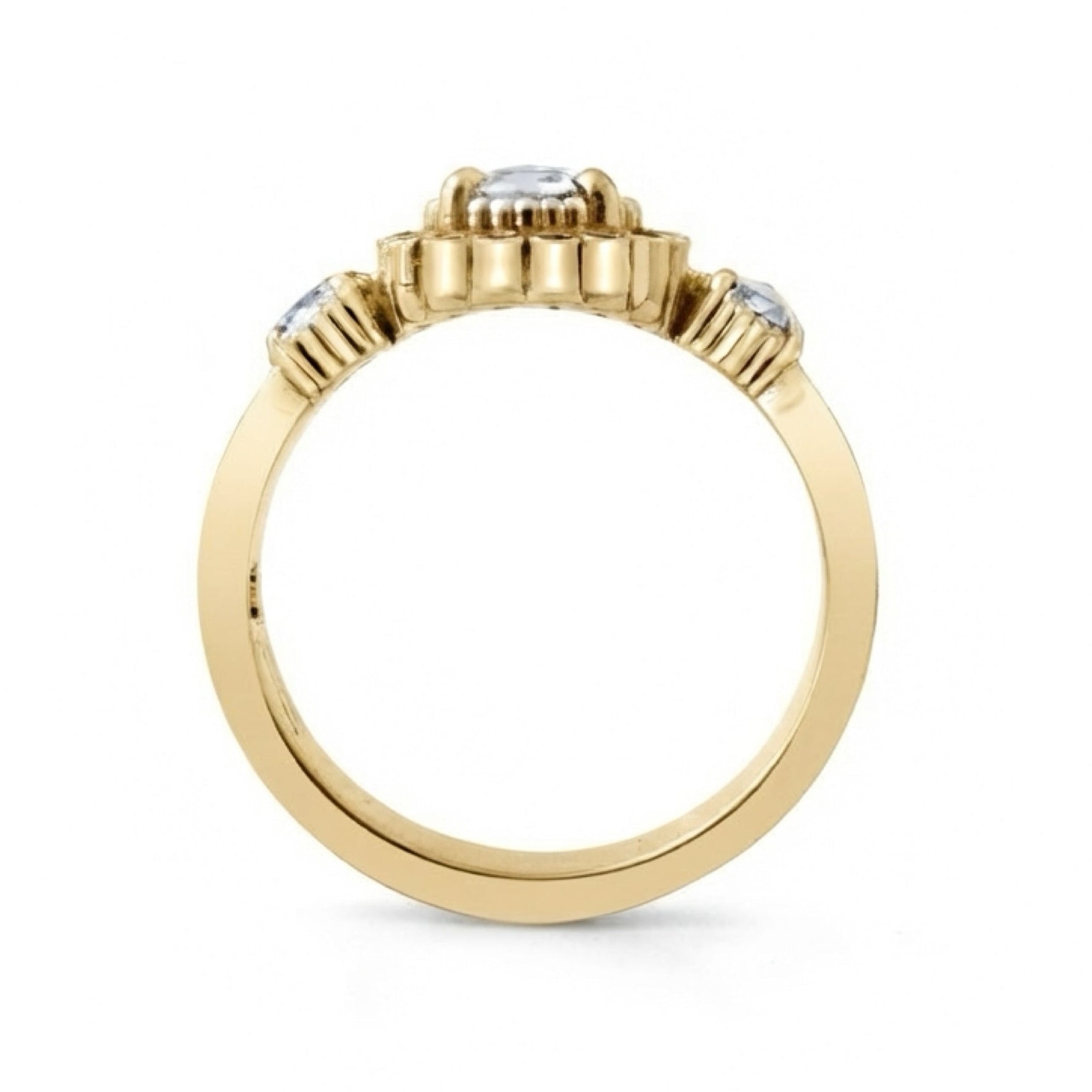 A yellow gold ring featuring a central round clear gemstone in a prong setting, with two smaller round clear gemstones on either side of the band, shown on a plain white background.