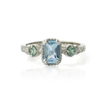 14kt gold vintage-style ring with emerald-cut aquamarine centre and two round alexandrite gemstones, featuring hand-engraved details.