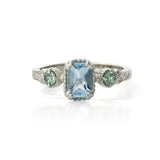 14kt gold vintage-style ring with emerald-cut aquamarine centre and two round alexandrite gemstones, featuring hand-engraved details.