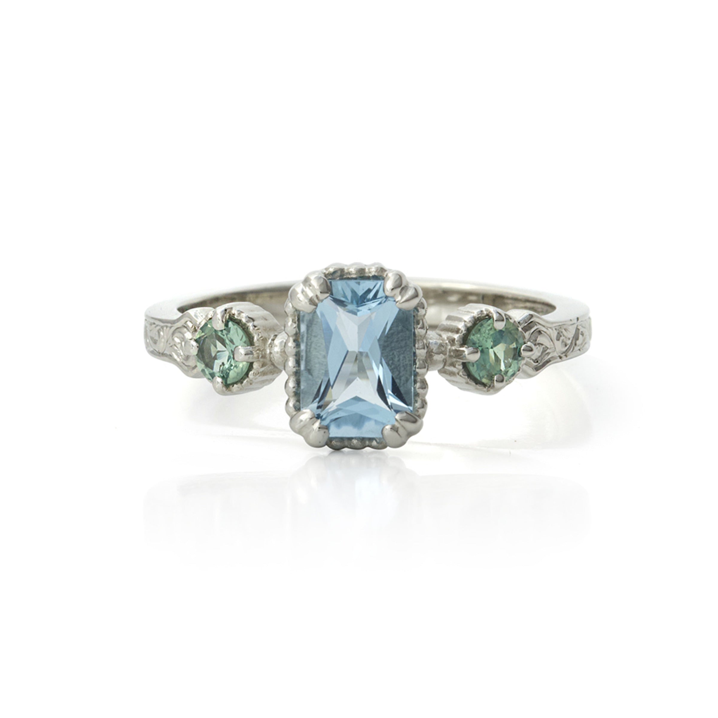 14kt gold vintage-style ring with emerald-cut aquamarine centre and two round alexandrite gemstones, featuring hand-engraved details.
