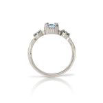 14kt gold vintage-style ring with emerald-cut aquamarine centre and two round alexandrite gemstones, featuring hand-engraved details.